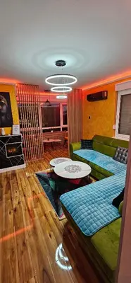 a living room with a couch and a table at Smart Lux in Tuzla