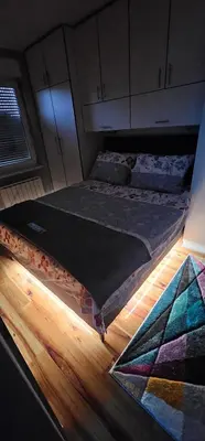 a room with two beds sitting on the floor at Smart Lux in Tuzla