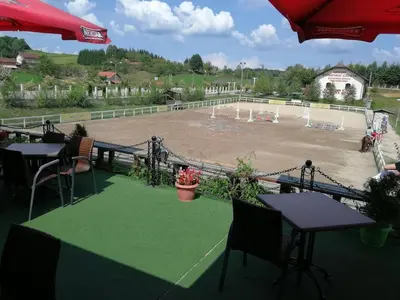 a view of a horse race track with tables and chairs at Suncev Brijeg in Banja Luka