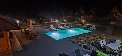 an overhead view of a swimming pool at night at Suncev Brijeg in Banja Luka
