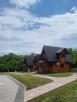 a log cabin with a black roof at Suncev Brijeg in Banja Luka