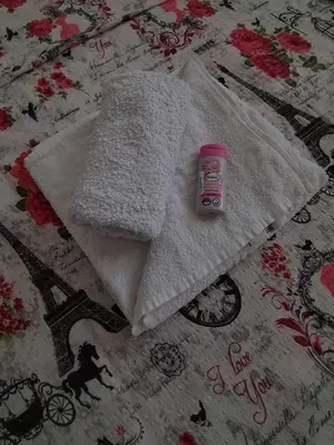 a bottle of milk sitting on top of a bed at Gold Home in Bosanska Gradiška