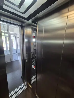 a elevator in a building with a door and a hallway at The Urbanite in Bihać
