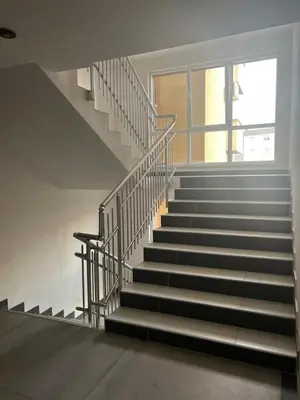 a staircase in a building with a window at Apartman Nora in Teslić