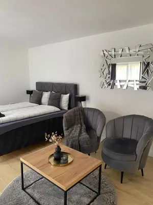 a living room with a couch and two chairs and a table at Apartman Rawda 1 in Jajce