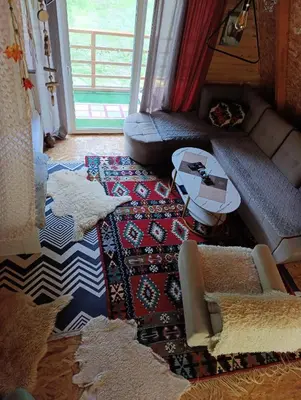 a living room with a couch and a table at Visoko Pyramid VALLEY in Visoko