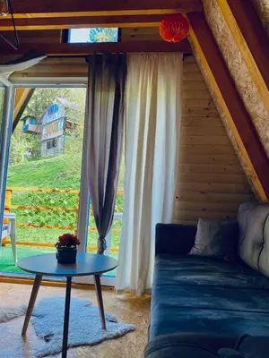 a living room with a couch and a table at Visoko Pyramid VALLEY in Visoko