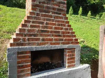 a brick fireplace with a staircase in a yard at Visoko Pyramid VALLEY in Visoko