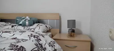 a bedroom with a bed and a lamp on a nightstand at Villa Seferovka in Kulen Vakuf