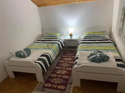 two beds sitting next to each other in a room at Villa Seferovka in Kulen Vakuf