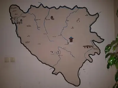 a wall mural of a map of spain on a wall at Adnna Home in Bihać