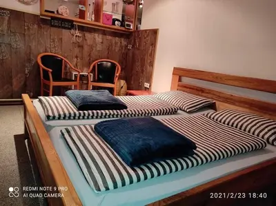 two twin beds sitting next to each other in a bedroom at Adnna Home in Bihać