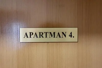 a sign on a wooden door with the name of araparian four at Green River Rooms in Šipovo