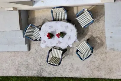 an aerial view of a table and chairs with roses at Green River Rooms in Šipovo