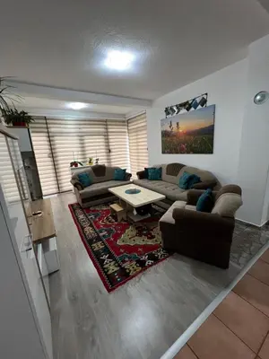 a living room with couches and a coffee table at Teal Apartment 1 in Bihać