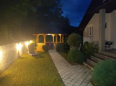 a backyard of a house at night at Apartments A&D in Bihać