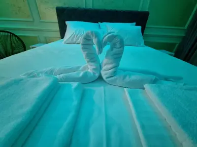 a bed with a pair of socks on it at Apartman Spa kristal in Banja Luka