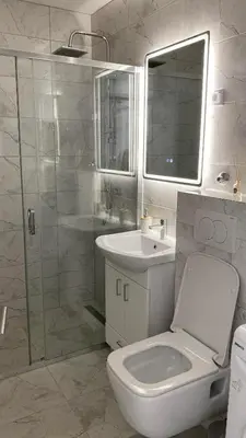 a bathroom with a toilet and a sink and a shower at Apartment Diletta in Banja Luka