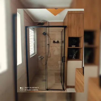 a shower with a glass door in a bathroom at Tesla Apartman Prnjavor in Prnjavor