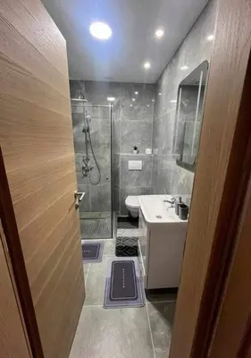 a bathroom with a shower and a sink at Apartman DEA in Bihać