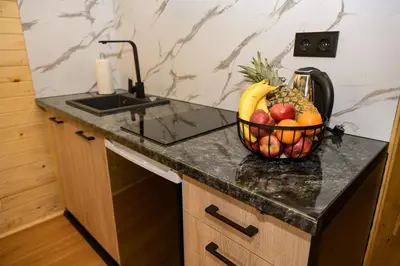 a bowl of fruit on a counter in a kitchen at Cottage NIKA in Jajce