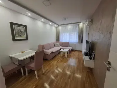 a living room with a couch and a table at Nela Bl in Banja Luka