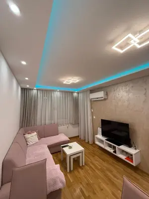 a living room with a couch and a tv at Nela Bl in Banja Luka