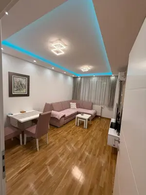 a living room with a couch and a table at Nela Bl in Banja Luka