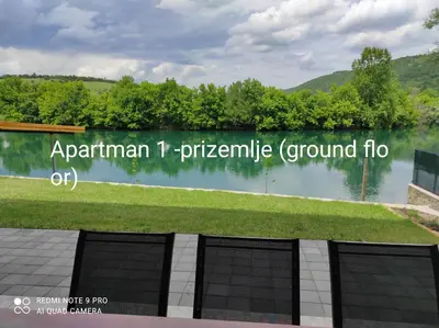 a view of a lake with the words apartment t pierceville ground fl at Vila Didan-apartmani in Bihać