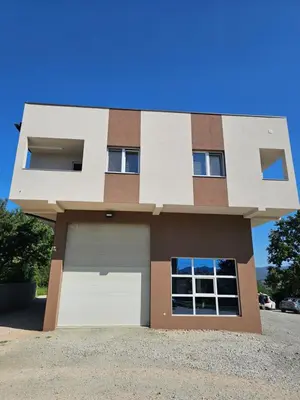 a rendering of a house with a garage at Apartmani gradina Tuzla in Tuzla