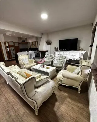 a large living room with couches and a tv at Holiday house 