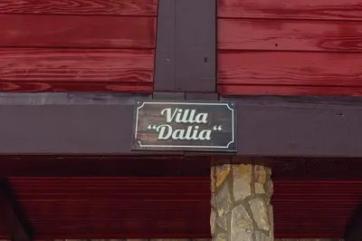 a sign on the side of a building at Holiday house 