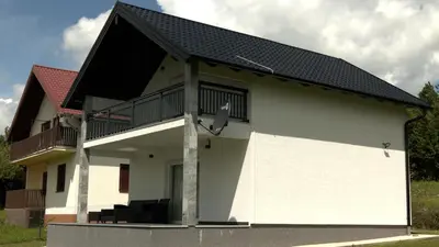 a white house with a black roof at Kuća za odmor GAVRIĆ in Mrkonjić Grad