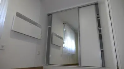 a mirror on a wall in a room at Kuća za odmor GAVRIĆ in Mrkonjić Grad