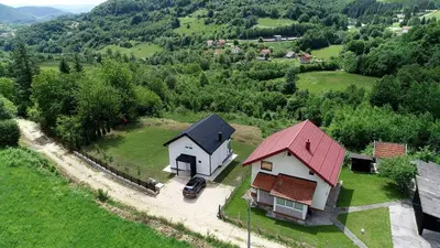 an aerial view of two houses in a field at Kuća za odmor GAVRIĆ in Mrkonjić Grad