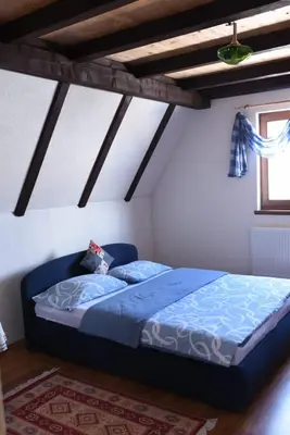 a bedroom with a blue bed in a room at Brano in Kupres