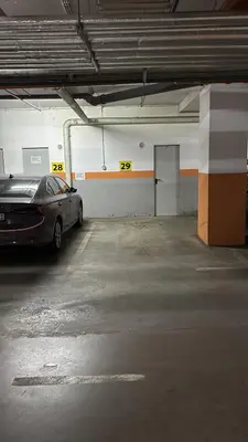 a parking garage with a car parked in it at Central Luxe in Banja Luka