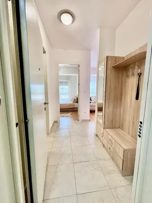 a hallway of a home with a tile floor at Central Luxe in Banja Luka