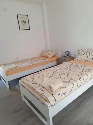 two beds sitting in a room withermottermottermott at Bloom in Šipovo