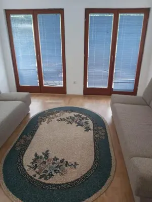 a living room with a rug on the floor at 