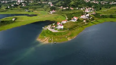 an aerial view of a small island in the water at Camp Tommy in Jaklići