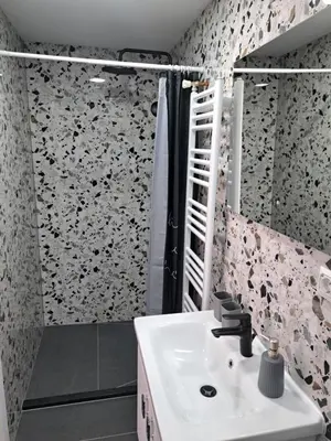 a bathroom with a sink and a shower at Ina in Kupres