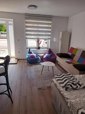 a living room with a couch and a table at Ina in Kupres