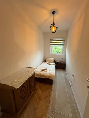 a small room with two beds and a window at Comfort house near pyramids II in Visoko