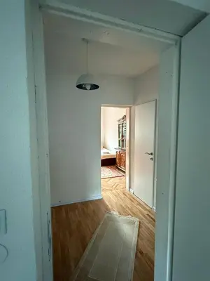 an empty room with a hallway leading to a bedroom at Comfort house near pyramids II in Visoko