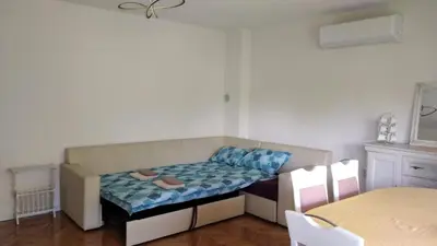 a small room with a couch and a table at Comfort house near pyramids II in Visoko