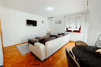 a living room with a couch and a table at Apartman Deja vu in Livno