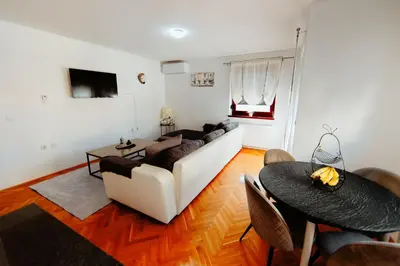 a living room with a couch and a table at Apartman Deja vu in Livno