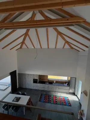 a living room with a table and a couch at Vila Trnovac in Bužim