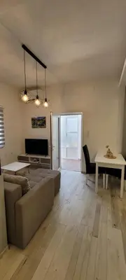 a living room with a couch and a table at Oz Lux Apartments in Bihać